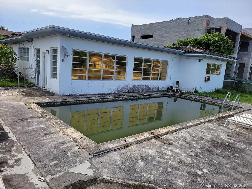 Rear elevation and pool of the Keystone single-family house as acquired, Miami-Dade County